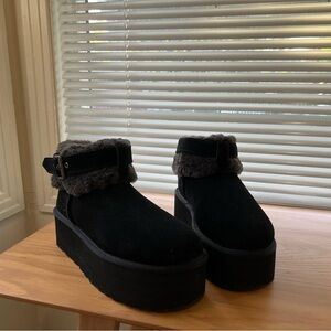 UGG Ultra Mini Belted Black Fur-Lined Platform Boots